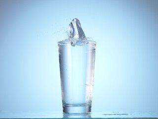 Dropping ice cube into glass