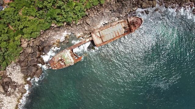 The rusty shipwreck run aground. Sri Lanka