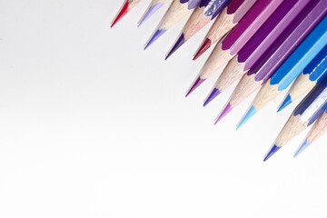 Many Color pencils isolated on white background close up. Color pencils for drawing as a background