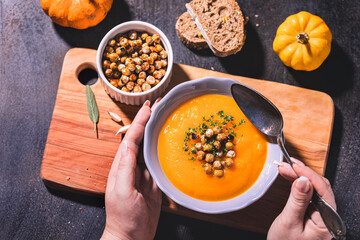 Homemade pumpkin soup with crispy roasted chickpeas