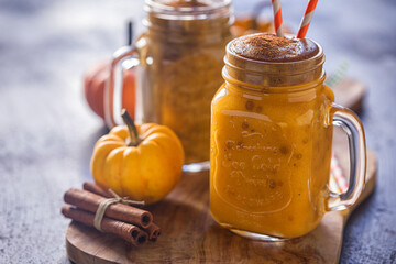 Pumpkin smoothie with cinnamon in a jar	