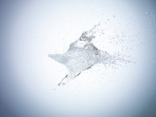 Exploding water balloon on white background