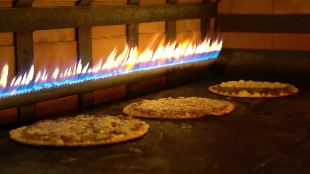 Close up shot of lebanese pizzas baked in the gas oven