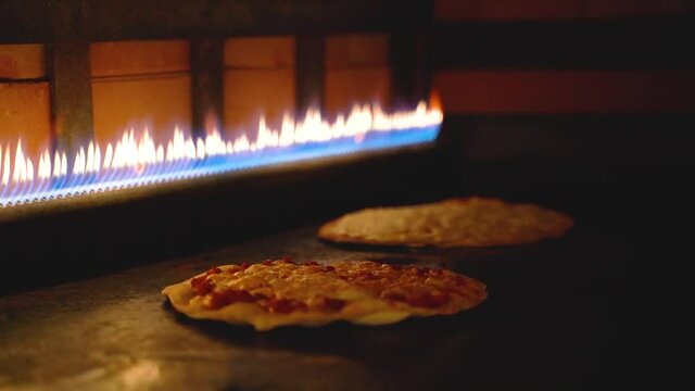 Close up of Lebanese Arabian Pizza cooking in the oven and the cheese melting