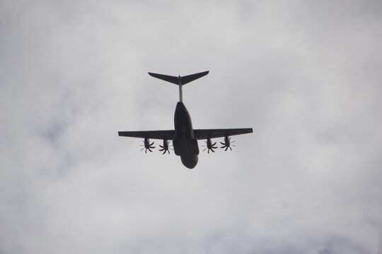 Airbus A440M passing by, flying low. Military play silhouette.