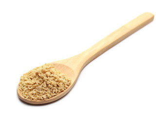 Soy flakes isolated with wooden spoon on white background