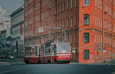 Fototapeta na wymiar Typical articulated tram on the streets of St. Petersburg. Public transport concept.