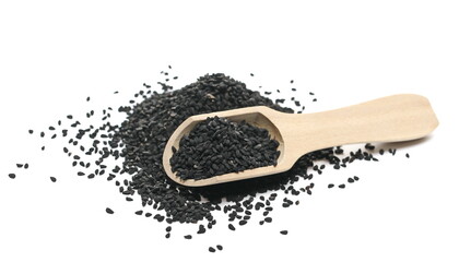 Black cumin, caraway seeds with wooden spoon isolated on white background