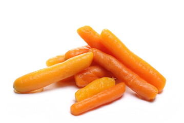 Cooked baby carrots isolated on white background