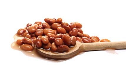 Cooked brown beans with wooden spoon isolated on white background