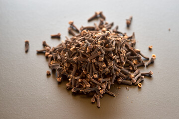 Heap of clove spices lies on the table