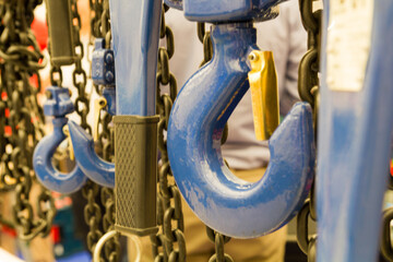 blue hook hanging from a chain