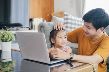Young man and school-girl working form home and e-learning.