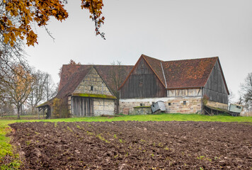 old farmhouse at autumn time