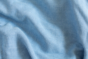 Fototapeta na wymiar Blue cotton denim texture. Draped