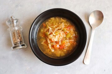 Body cleansing & detox Homemade Weight Loss Wonder Soup. veg soup made of tomatoes, capsicums, carrots, cabbage and onions. seasoned with salt and pepper. Low calorie diet vegetables soup. copy space.