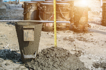 Concrete Slump Testing of mixing concrete checking workability in field construction site