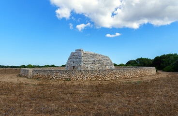 Naveta des Tudons with surrounding wall, Prehistoric Tomb - Menorca, Balearic islands, Spain