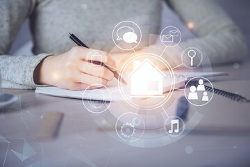 IOT drawing over writing hands in notepad background. Concept of smart home. Multi exposure