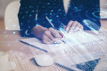 IOT drawing over writing hands in notepad background. Concept of smart home. Multi exposure
