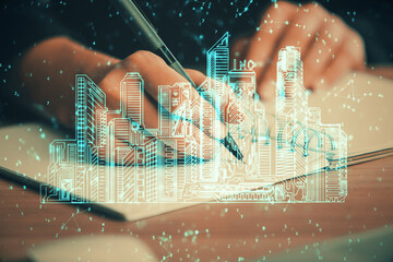 IOT drawing over writing hands in notepad background. Concept of smart home. Multi exposure