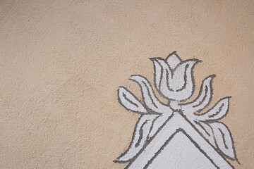 Detail of antique facade decorative ornaments in Mustair.