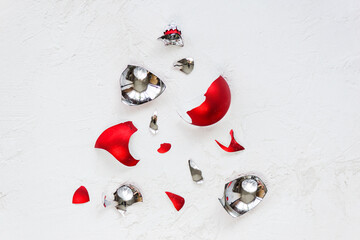 Broken Christmas ball in the form of a Christmas tree on a light background. Horizontal...