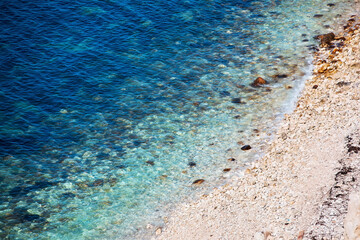 Fototapeta na wymiar Texture of sea water. Summer background. Ocean coast.
