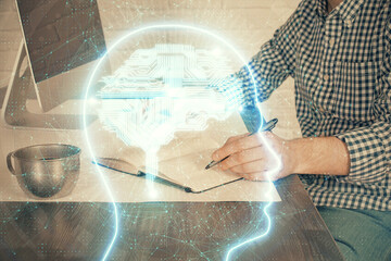 Fototapeta na wymiar Man typing on keyboard background with brain hologram. Concept of big Data. Double exposure.