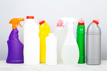 Various detergents and cleaning products agent, gray background