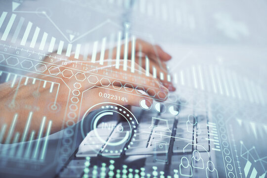 Technology theme hologram with man working on computer on background. High tech concept. Multi exposure.