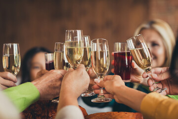 Full happy family clinking glasses thanks giving party garnished turkey dinner table house living...