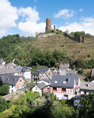 half timbered houses and castle ruin in beautiful village of Monreal in german eifel