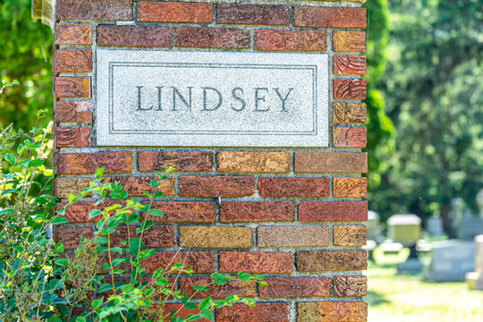 Brick pillar on a gate with a granite plaque with Lindsey engraved in it.  Lindsey Ohio