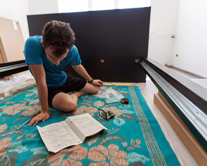 Man assembling his new furniture