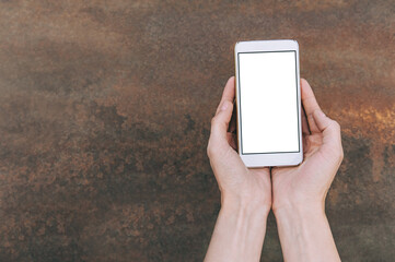 Close-up, mock-up of a smartphone, in the palm of a girl's hands.