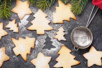 Christmas greeting card with fir tree and gingerbread cookies
