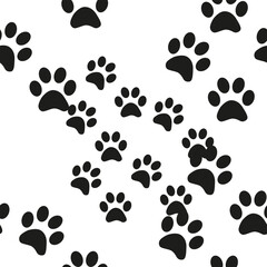 Black and white seamless pattern with paw prints. Abstract background, animal footprint, illustration.