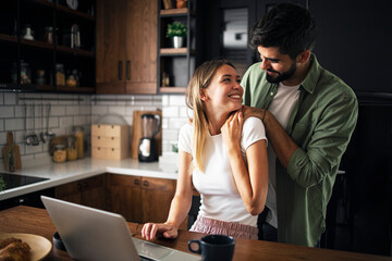 Happy young couple in their new apartment