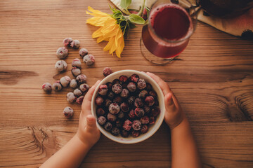 Still life. Frozen cherries and cherry juice on wooden background