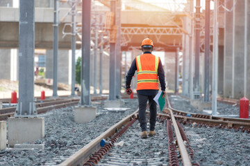 engineer walking and check track work on railways. people walk on railway .