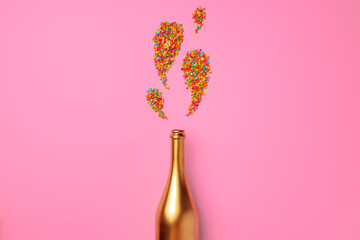 Champagne bottle with confetti flat lay top view