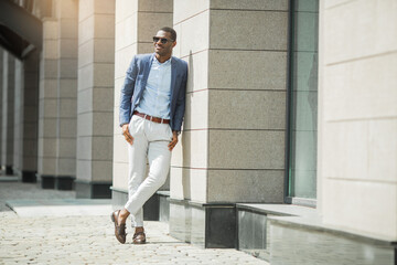 handsome adult african man in suit and sunglasses