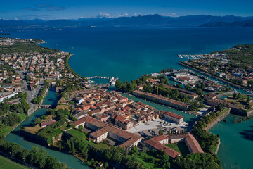 Fototapeta na wymiar Aerial view of Peschiera del garda, garda lake, Italy. Early morning aerial view. Lake Garda