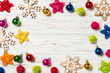 Top view of Christmas decorations and toys on wooden background. Copy space. Empty place for your design. New Year concept