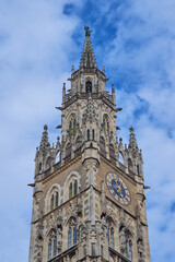 Top of the clock tower of Rathaus, closeup. Detail of the New Town Hall at Marienplatz in Munich