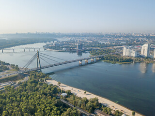 North bridge over the Dnieper river in Kiev. Aerial drone view.