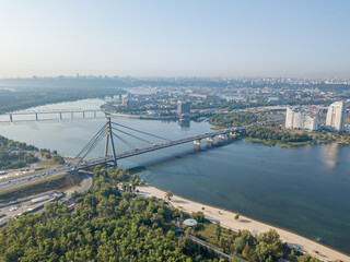 Fototapeta premium North bridge over the Dnieper river in Kiev. Aerial drone view.