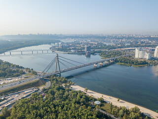 North bridge over the Dnieper river in Kiev. Aerial drone view.