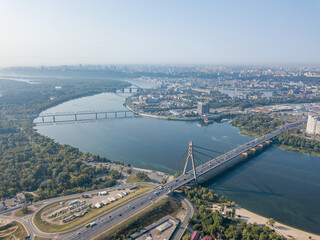 North bridge over the Dnieper river in Kiev. Aerial drone view.